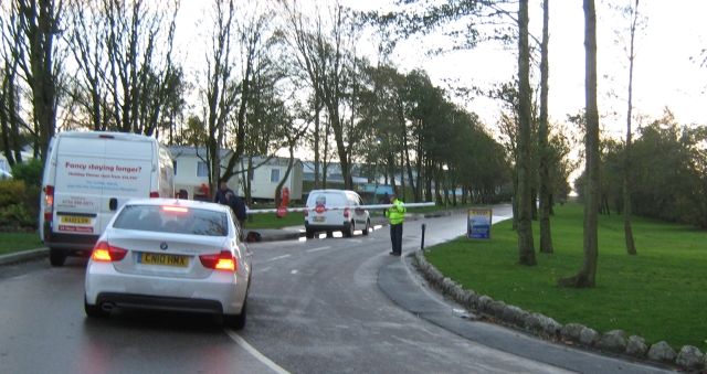 a partially closed barrier in front of the caravan site in flookburgh